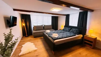 Ein Bett oder Betten in einem Zimmer der Unterkunft Lakeside Olti Apartment near Interlaken