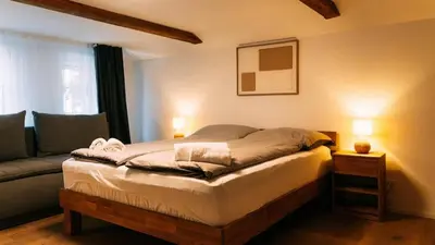 Ein Bett oder Betten in einem Zimmer der Unterkunft Lakeside Lela Apartment near Interlaken