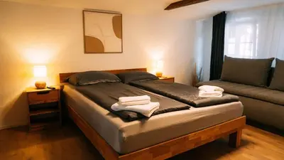 Ein Bett oder Betten in einem Zimmer der Unterkunft Lakeside Lela Apartment near Interlaken