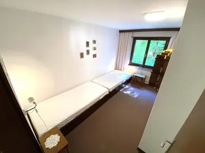 Ein Bett oder Betten in einem Zimmer der Unterkunft Lärchenwald 1803