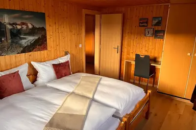 Ein Bett oder Betten in einem Zimmer der Unterkunft Chalet Alpenheim 2 OG