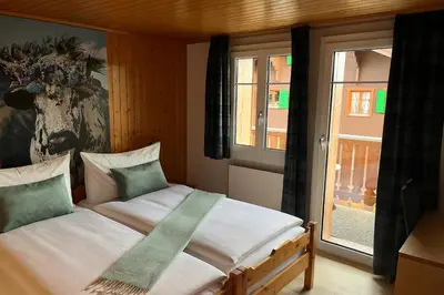 Ein Bett oder Betten in einem Zimmer der Unterkunft Chalet Alpenheim 2 OG
