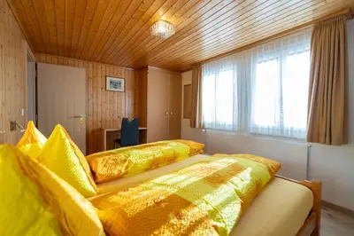 Ein Bett oder Betten in einem Zimmer der Unterkunft Chalet Alpenheim 1 OG