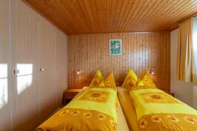 Ein Bett oder Betten in einem Zimmer der Unterkunft Chalet Alpenheim 1 OG