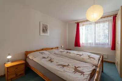 Ein Bett oder Betten in einem Zimmer der Unterkunft Chalet Capricorn