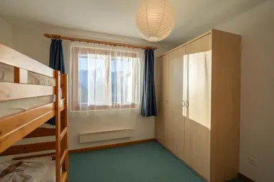 Ein Bett oder Betten in einem Zimmer der Unterkunft Chalet Capricorn