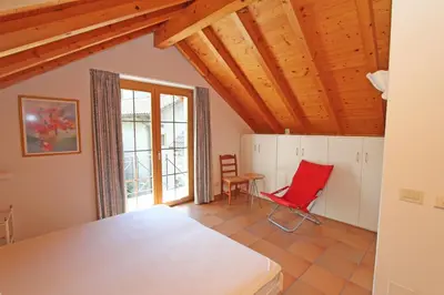 Ein Bett oder Betten in einem Zimmer der Unterkunft Rustico Camelia by HolAp SA