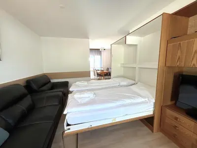 Ein Bett oder Betten in einem Zimmer der Unterkunft Royal 52