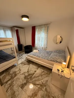Ein Bett oder Betten in einem Zimmer der Unterkunft swisscheapholiday apartment
