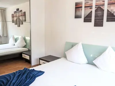 Ein Bett oder Betten in einem Zimmer der Unterkunft Apartment Rubin by Interhome