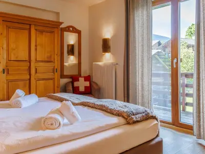 Ein Bett oder Betten in einem Zimmer der Unterkunft Chalet Victoria-2 by Interhome