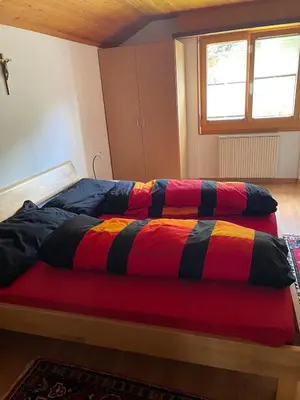 Ein Bett oder Betten in einem Zimmer der Unterkunft Ferienwohnung Giltstein in Mörel