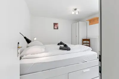 Ein Bett oder Betten in einem Zimmer der Unterkunft Zermatt, 4 pers, 3 lits - Balcon avec vue et petit jardin