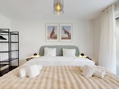Ein Bett oder Betten in einem Zimmer der Unterkunft Bright flat with terrace in Sierre