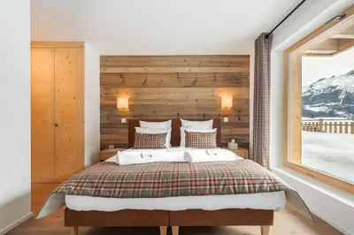 Ein Bett oder Betten in einem Zimmer der Unterkunft Guernerés & Spa by Alpine Resorts