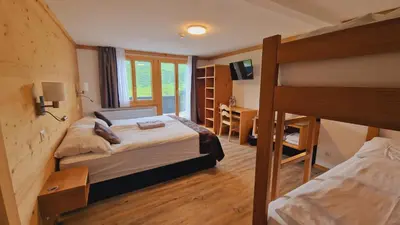 Ein Bett oder Betten in einem Zimmer der Unterkunft Berghotel Hahnenmoos