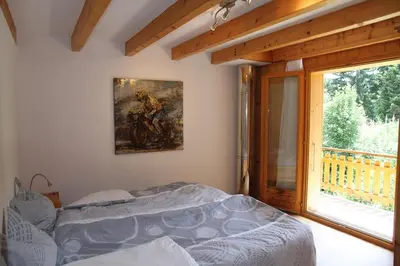 Ein Bett oder Betten in einem Zimmer der Unterkunft Chalet Ski in&out