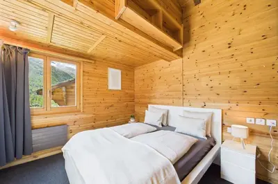 Ein Bett oder Betten in einem Zimmer der Unterkunft Family & friends cabin in Saas-Fee