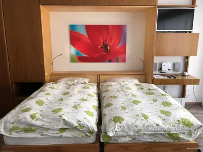 Ein Bett oder Betten in einem Zimmer der Unterkunft Center Studio Zermatt by Inspiring places Zermatt
