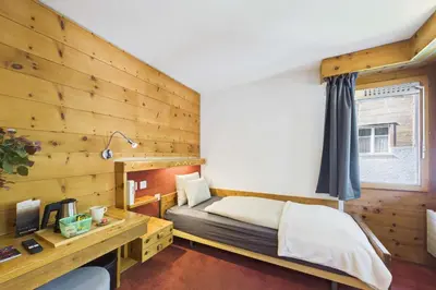 Ein Bett oder Betten in einem Zimmer der Unterkunft Cozy Single Suite in the Heart of Saas-Fee