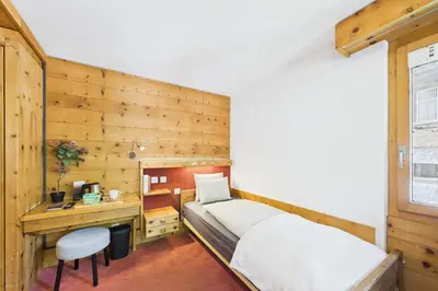 Ein Bett oder Betten in einem Zimmer der Unterkunft Cozy Single Suite in the Heart of Saas-Fee