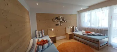 Ein Bett oder Betten in einem Zimmer der Unterkunft Silberblick Ferienwohnungen - aussergewöhnlich & familienfreundlich