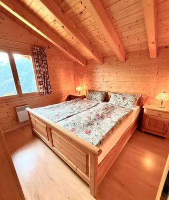 Ein Bett oder Betten in einem Zimmer der Unterkunft Chalet Poiema