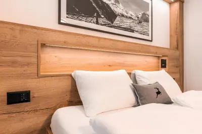 Ein Bett oder Betten in einem Zimmer der Unterkunft Studio Enzian - Matterhorn Sicht bei der Bergbahn Inspiringplaceszermatt