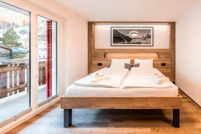 Ein Bett oder Betten in einem Zimmer der Unterkunft Studio Enzian - Matterhorn Sicht bei der Bergbahn Inspiringplaceszermatt