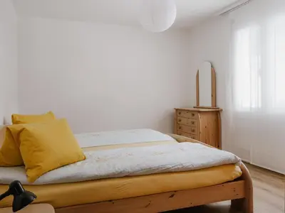 Ein Bett oder Betten in einem Zimmer der Unterkunft Apartment Casa Yolanda 2- OG Süd by Interhome