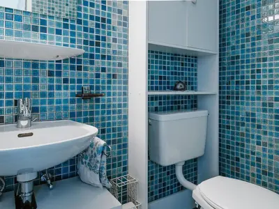 Ein Badezimmer in der Unterkunft Apartment Casa Yolanda 2- OG Süd by Interhome