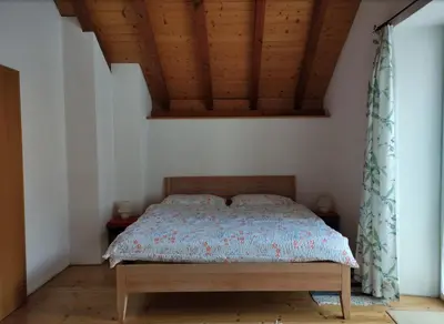 Ein Bett oder Betten in einem Zimmer der Unterkunft Eline sotto ai piazz 12 Casa Elin