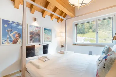 Ein Bett oder Betten in einem Zimmer der Unterkunft Swiss Family Chalet