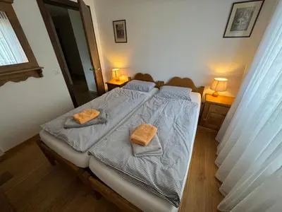 Ein Bett oder Betten in einem Zimmer der Unterkunft Terrasse des Alpes 2005