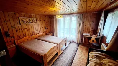 Ein Bett oder Betten in einem Zimmer der Unterkunft FREE Bus Winter Haus Ramona