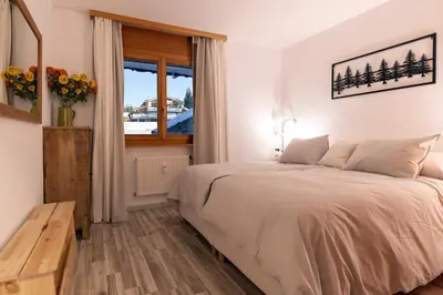 Ein Bett oder Betten in einem Zimmer der Unterkunft Crans-Montana - FABULOUS 2-bedroomed flat
