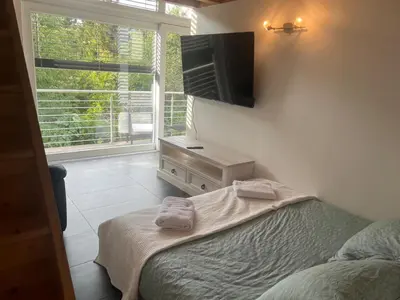 Ein Bett oder Betten in einem Zimmer der Unterkunft Loft lumineux et confortable