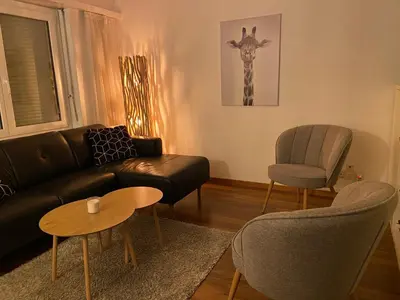 Ein Sitzbereich in der Unterkunft Appartement cosy proche ski et bains thermaux
