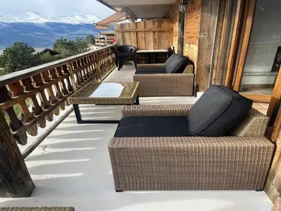 Ein Sitzbereich in der Unterkunft Luxury apartment in Veysonnaz