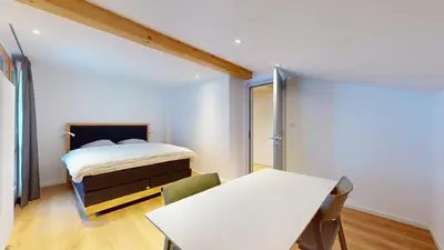 Ein Bett oder Betten in einem Zimmer der Unterkunft Chalet de l'Ours AUTHENTIC Appart Chambésy 6 pers
