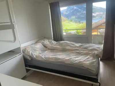Ein Bett oder Betten in einem Zimmer der Unterkunft Dream vacation spiez with view