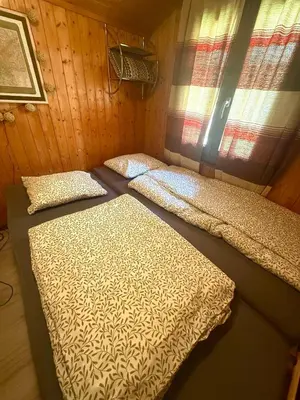 Ein Bett oder Betten in einem Zimmer der Unterkunft Chalet Opalpin Lodge & Spa, vue montagne et jacuzzi