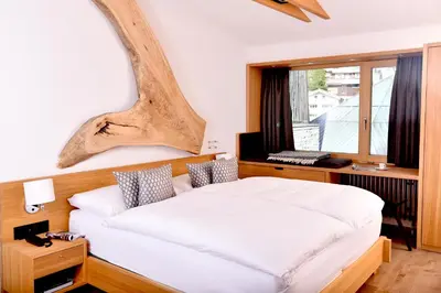 Ein Bett oder Betten in einem Zimmer der Unterkunft The Dom Hotel Saas-Fee operated by Dorint