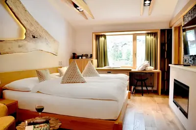 Ein Bett oder Betten in einem Zimmer der Unterkunft The Dom Hotel Saas-Fee operated by Dorint