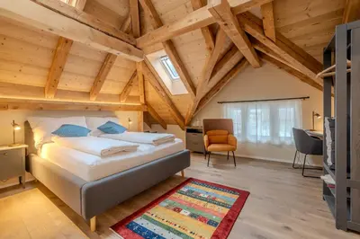 Ein Bett oder Betten in einem Zimmer der Unterkunft B&B Wild und Wandel Meiringen