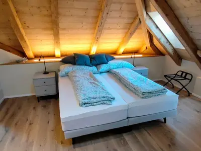Ein Bett oder Betten in einem Zimmer der Unterkunft B&B Wild und Wandel Meiringen
