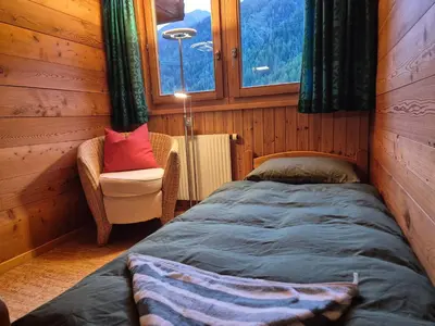 Ein Bett oder Betten in einem Zimmer der Unterkunft Gemütliches Walliser Chalet Nahe Aletschgebiet