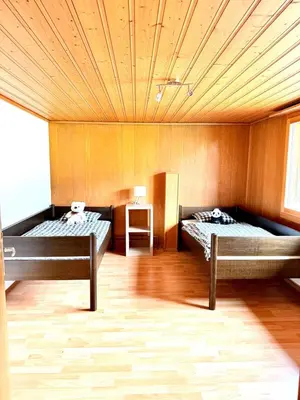 Ein Bett oder Betten in einem Zimmer der Unterkunft Wundervolle Alpenferien in Frutigen