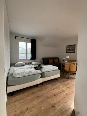 Ein Bett oder Betten in einem Zimmer der Unterkunft Apartment Spiez - Lake view - for 7 guests