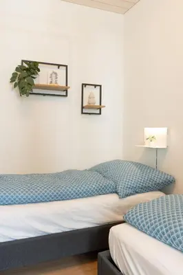 Ein Bett oder Betten in einem Zimmer der Unterkunft Scenic Apartment with Balcony View & Free Parking
